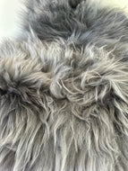 Sitteunderlag skinn grå